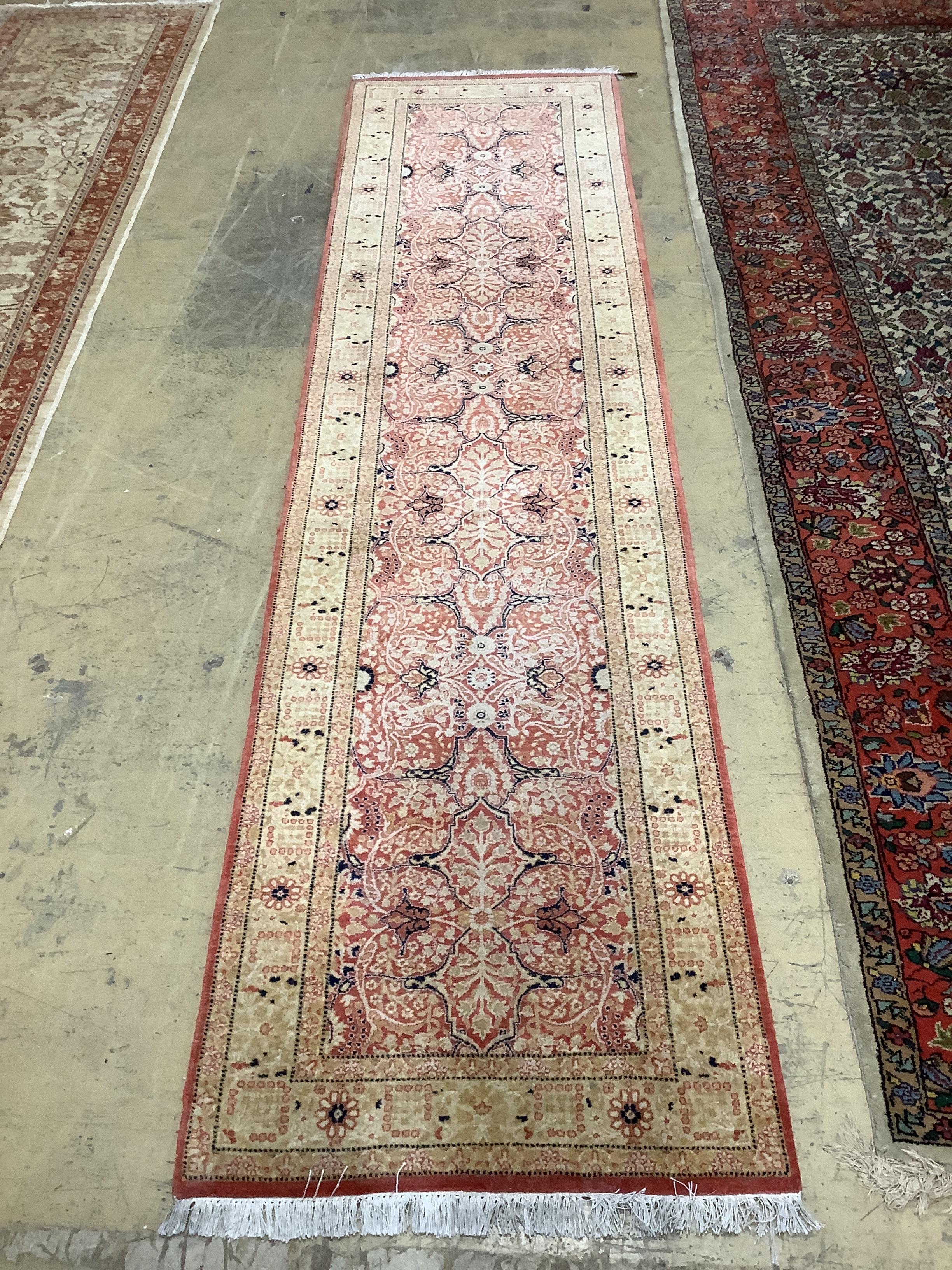 A North West Persian red ground runner, 310 x 79cm